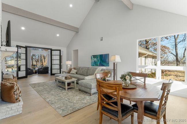 Formal living room with floor-to-ceiling brick fireplace | Image 27