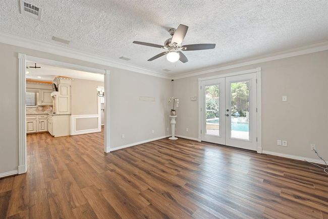 Second living area down has more French doors to the back and opens back to the front space making for a great entertaining flow. | Image 14
