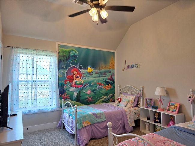 Carpeted bedroom featuring vaulted ceiling and ceiling fan | Image 29