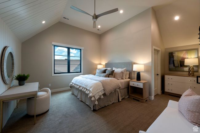 Bedroom featuring vaulted ceiling, light carpet, a ceiling fan, and recessed lighting | Image 45