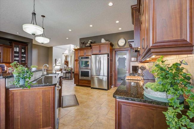 22 Tuscany Estates Crescent Nw, Home with 3 bedrooms, 2 bathrooms and 4 parking in Calgary AB | Image 12