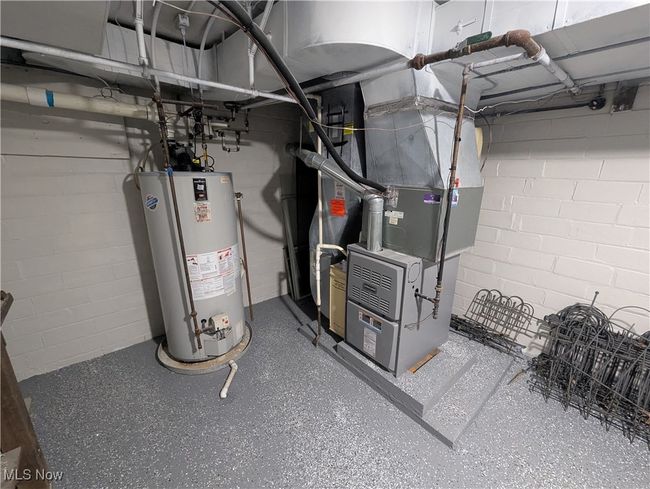 Utilities with heating unit and gas water heater | Image 29