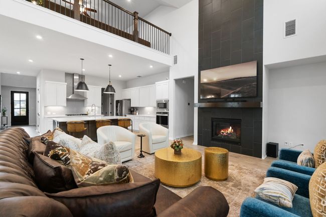 The living room is adjacent to the kitchen, making entertaining while meal prepping a breeze. | Image 11