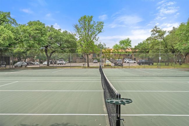 View of tennis court featuring fence | Image 33
