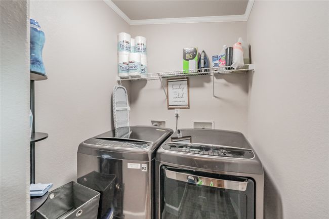 Laundry room with washer and dryer and crown molding | Image 24