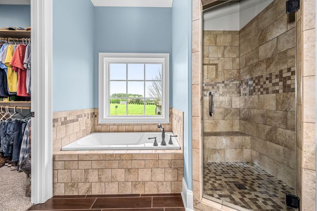 Your paragraph text Imagine stepping into a tranquil oasis where your worries melt away, and relaxation takes center stage. Whether you choose to unwind in the garden tub or the tiled shower, each offers its unique sanctuary of calm. | Image 57