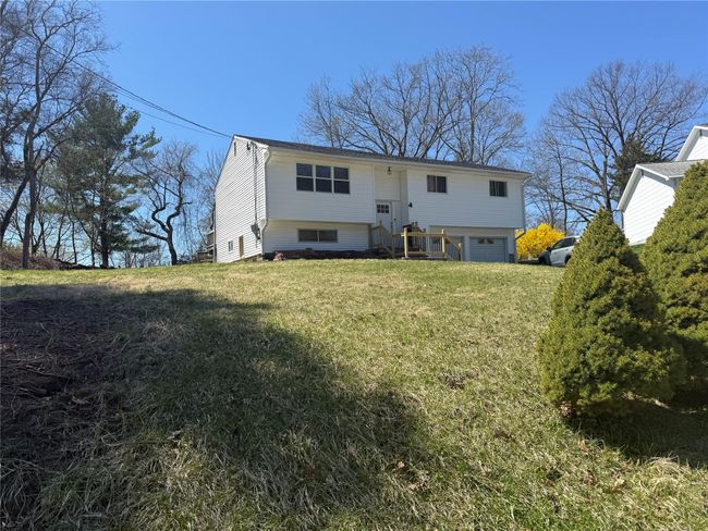 Back of property featuring a yard and a garage | Image 26