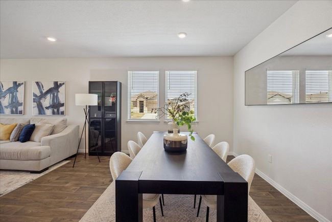 Dining space with healthy amount of natural light, dark wood finished floors, and recessed lighting | Image 11