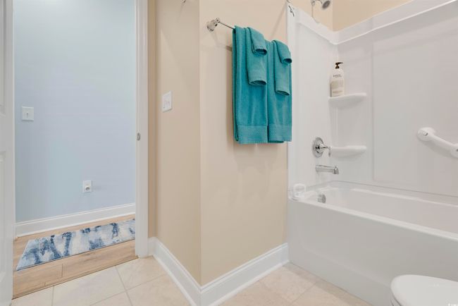 Bathroom with tile patterned flooring and shower combination | Image 28