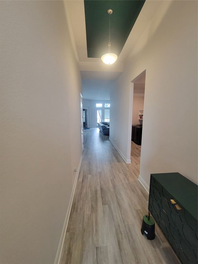 Hall featuring baseboards and light wood finished floors | Image 12