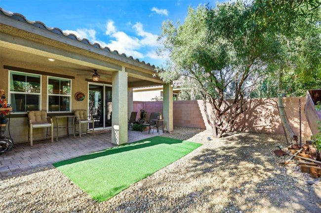 View of yard with a fenced backyard, ceiling fan, and a patio area | Image 36