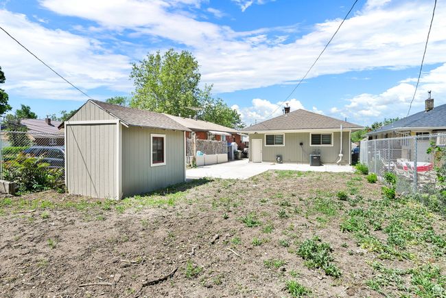 Back of house with a patio, a fenced backyard, and central AC | Image 20