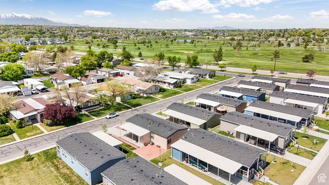 Aerial view of residential area with a local golf course and mountains | Image 18