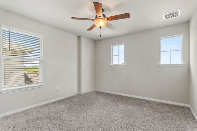 One of three guest bedrooms on second floor. | Image 23