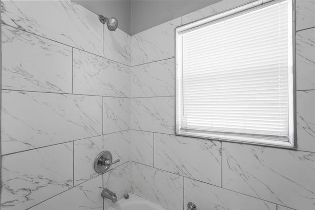 Full bathroom featuring bathtub / shower combination | Image 16