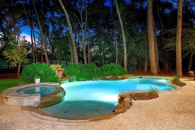 Beach entry pool with waterfalls on an impressive 1.47 acre lot | Image 46