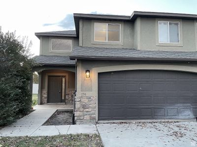 View of front of house featuring a garage | Image 1