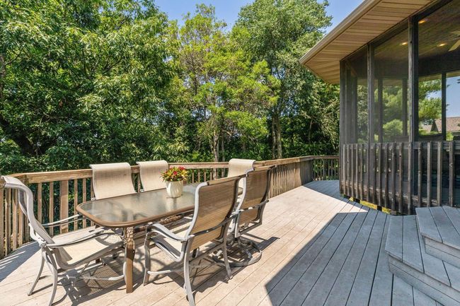 Oversized deck is perfect for entertaining with serene, lake views! | Image 40