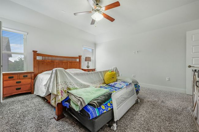 Carpeted bedroom with baseboards and ceiling fan | Image 17