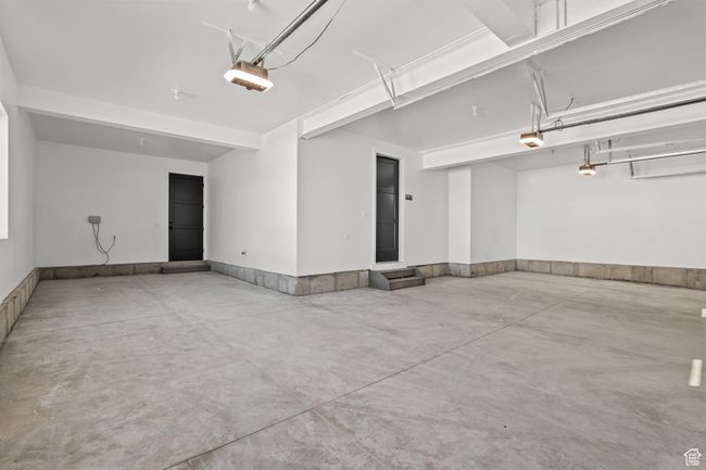 Garage with a garage door opener | Image 60