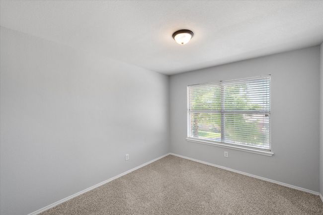 Unfurnished bedroom with new carpet | Image 33