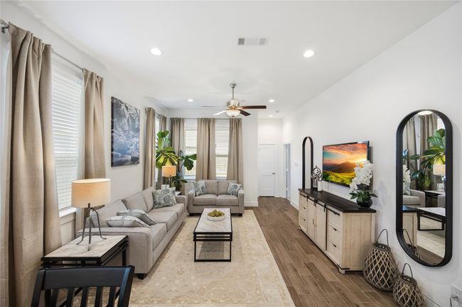 Spacious and full of natural light, the living room creates a welcoming atmosphere perfect for relaxing or entertaining. | Image 14