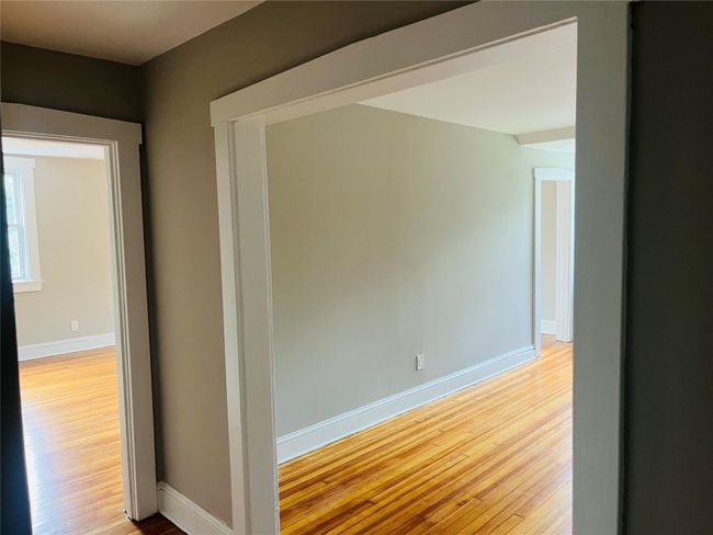View from entry hall into dining and living rooms | Image 10