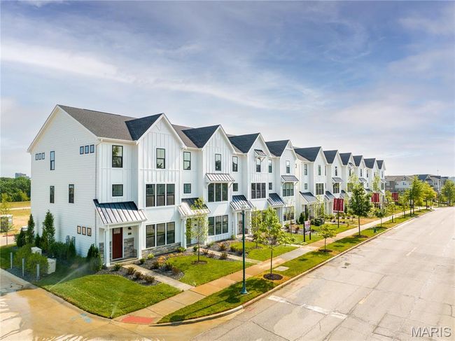View of property featuring a residential view, a standing seam roof, and a metal roof | Image 41
