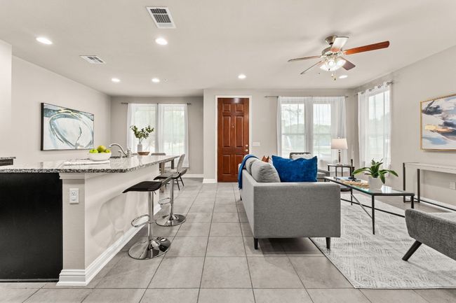 Living room with recessed lighting, plenty of natural light, ceiling fan, and light tile patterned floors | Image 6