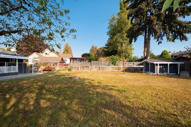 Fenced backyard with a sunroom | Image 33