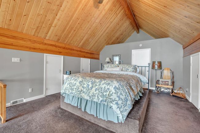 main bedroom upstairs has several side closets and storage with private bath | Image 30