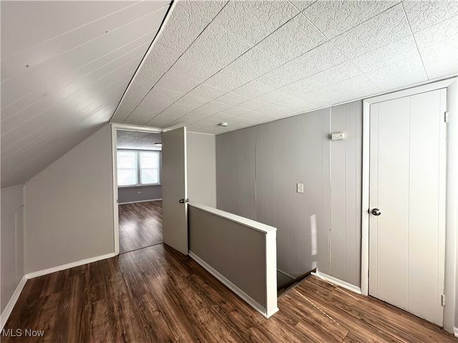 Bonus room featuring wood finished floors and baseboards | Image 9
