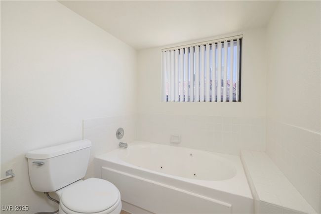 Bathroom with a tub with jets and toilet | Image 18