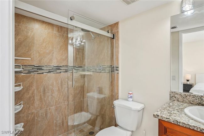 Bathroom featuring ensuite bath, vanity, and a stall shower | Image 19