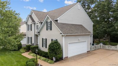 View of property exterior with a garage and a yard | Image 2