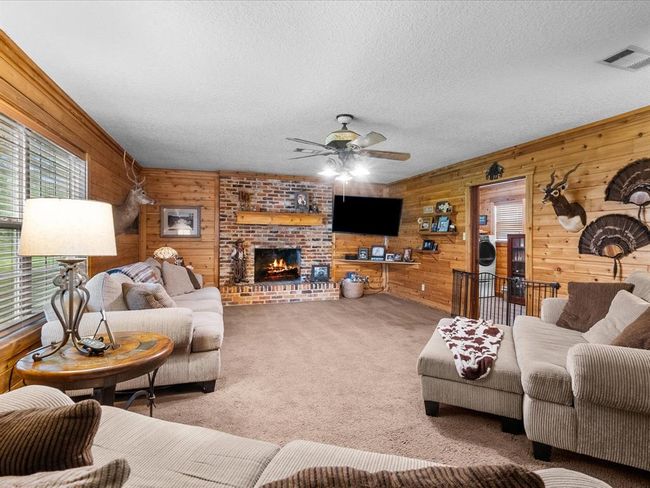 Cozy living room with gas log fire place | Image 20