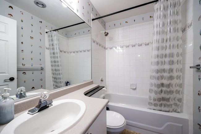 Full bath with vanity, toilet, and shower / bathtub combination with curtain | Image 13