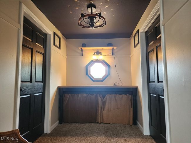 Entryway featuring carpet flooring and baseboards | Image 21