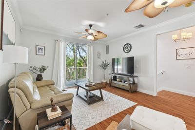 Spacious living room, showing staircase to front door | Image 3