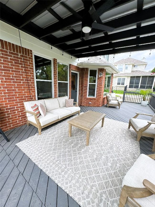Deck with an outdoor living space, and ceiling fan. | Image 37