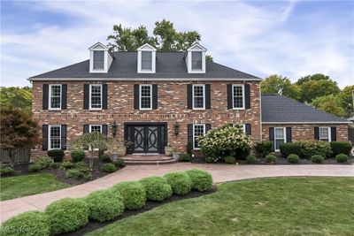 Colonial inspired home with a front lawn | Image 1