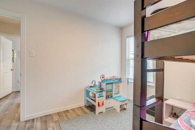 Bedroom featuring vinyl floors and baseboards | Image 23