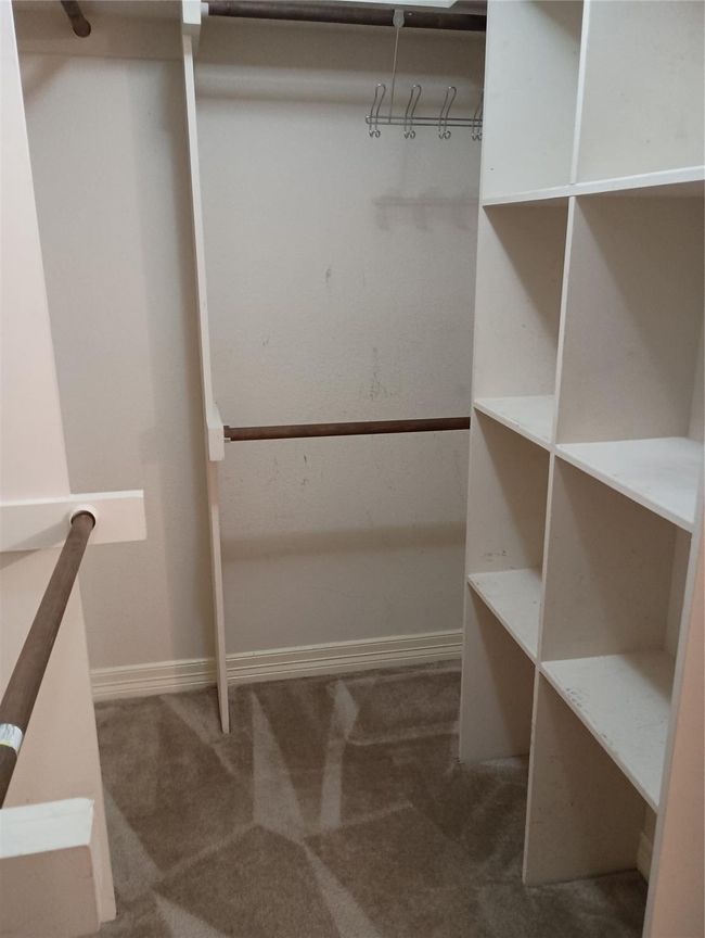 Large walk-in primary closet | Image 12