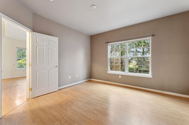 Main floor primary bedroom off of the living room | Image 5