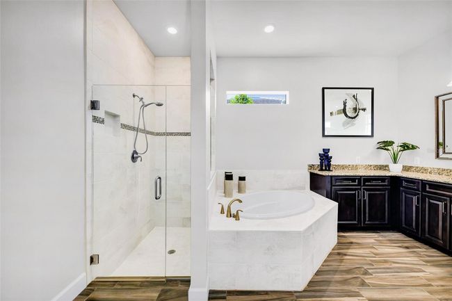primary ensuite bathroom with shower, tub, 2 vanities and a walk in closet | Image 38