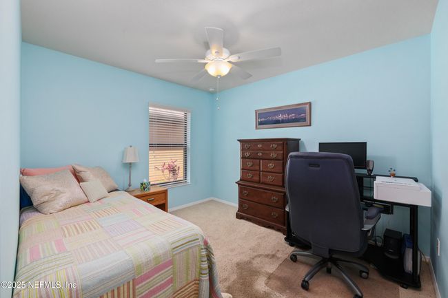Bedroom 2 offers comfort and privacy, located apart from the primary suite. | Image 14