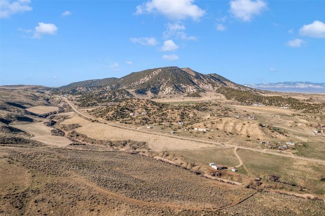 View of mountain backdrop featuring rural landscape | Image 14