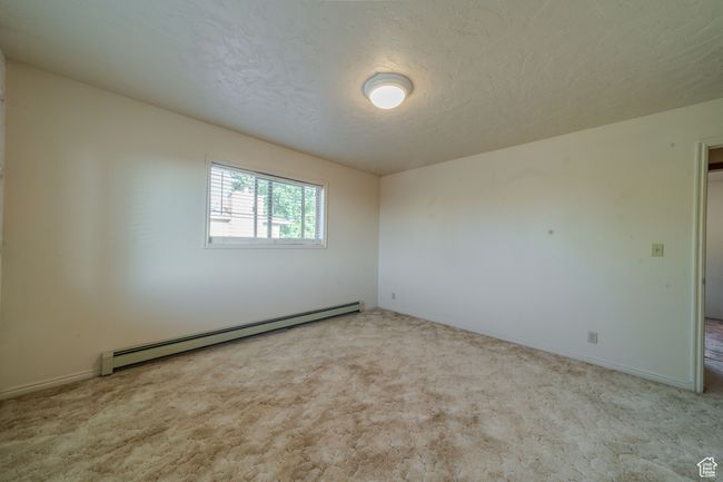 Carpeted spare room featuring, baseboards, and a textured ceiling | Image 24