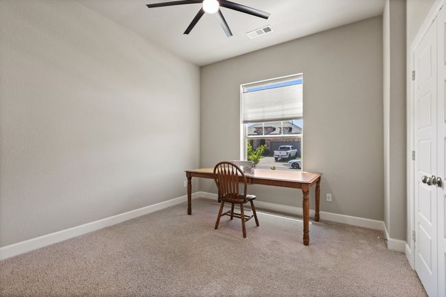 At the front of the house is this private bedroom and full bathroom | Image 10