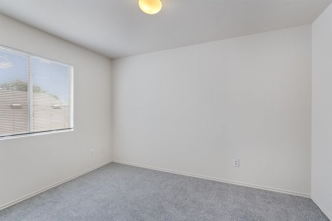 Carpeted empty room featuring baseboards | Image 23